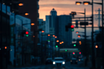 Defocused image of illuminated city at night