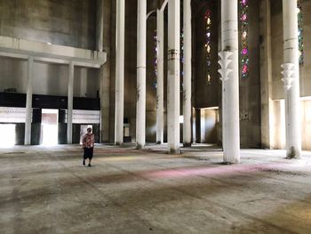 Full length of woman walking in building