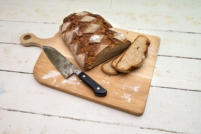 High angle view of bread on cutting board