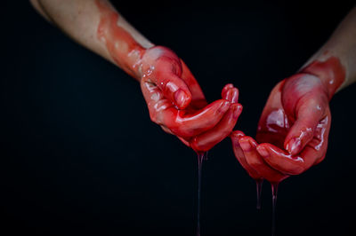 Close-up of woman bloody hands
