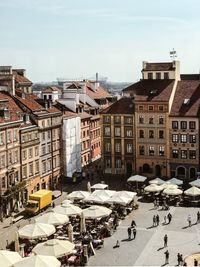 People in city against sky