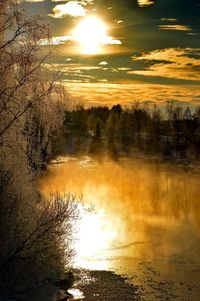 Scenic view of sunset over river