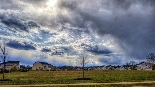 Scenic view of landscape against cloudy sky