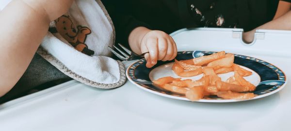 High angle view of woman preparing food on table