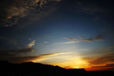 Scenic view of mountains at sunset