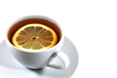 Close-up of coffee cup against white background