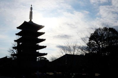 Low angle view of built structure against cloudy sky