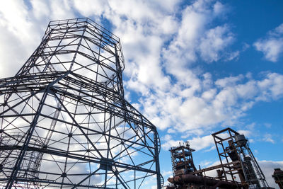 Low angle view of rollercoaster against sky