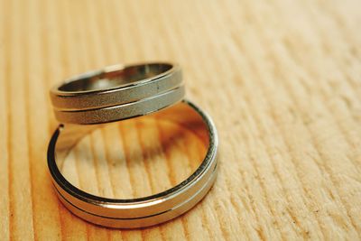 High angle view of wedding rings on table