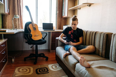 Digital addiction in tweens and teens, smartphone addicted. teenage boy playing online game