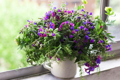 Close-up of pink flower pot on potted plant