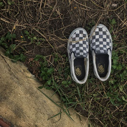 High angle view of shoes on field