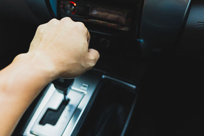 Midsection of person in car