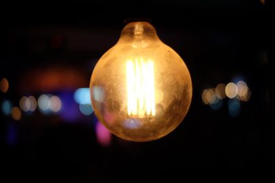 Close-up of illuminated light bulb