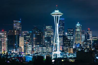 Illuminated buildings in city at night