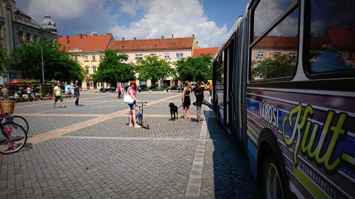 People walking on street in city