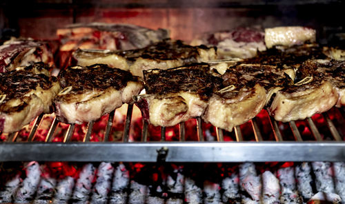 Close-up of meat on barbecue grill