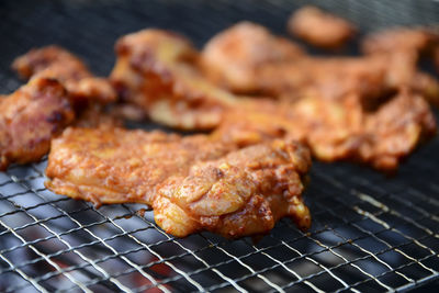 Close-up of meat on barbecue grill