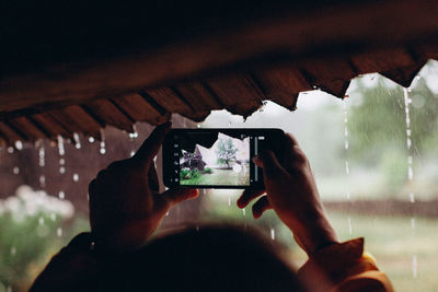 Man photographing through mobile phone