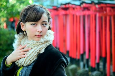 Portrait of young woman standing outdoors