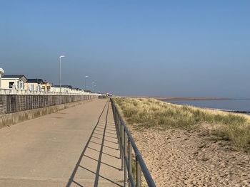 Scenic view of beach against clear sky