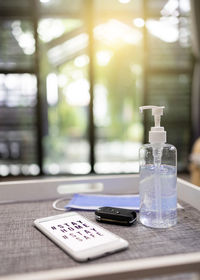 Close-up of glass bottle on table