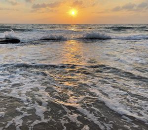 Scenic view of sea against sky during sunset