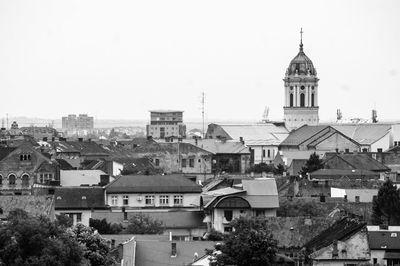 View of buildings in city against clear sky