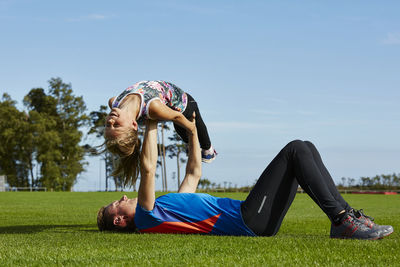 Father exercising with daughter