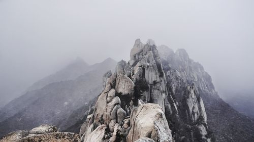 Panoramic view of rocky mountains against sky