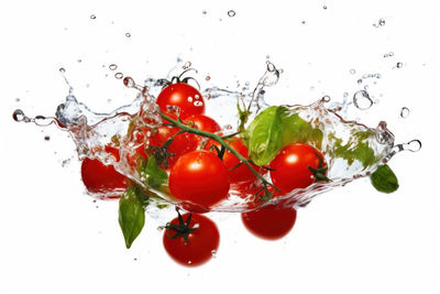 Close-up of cherry tomatoes against white background