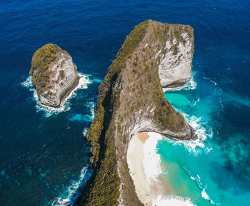 High angle view of rock formation in sea