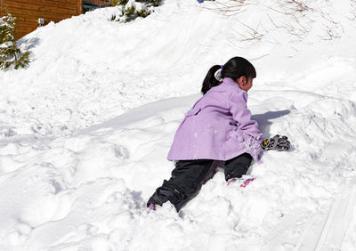 High angle view of woman in snow