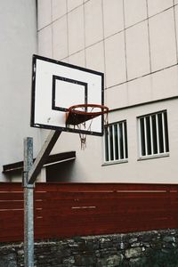 Low angle view of basketball hoop against building