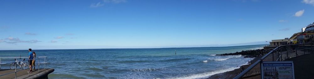 Scenic view of sea against blue sky