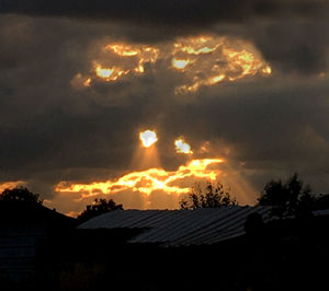 Silhouette of house at sunset