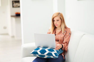 Young woman using mobile phone