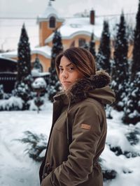 Portrait of woman standing in snow