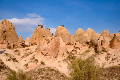 Panoramic view of rock formations against sky