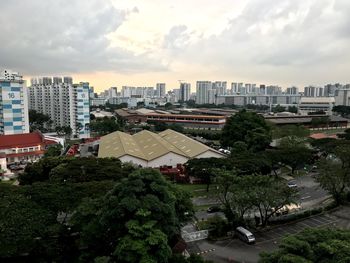 High angle view of trees and buildings against sky