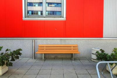 Empty bench in front of building