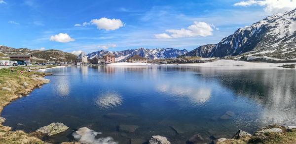 Ultra wide panorama of the lake in the gotthardpass with snow