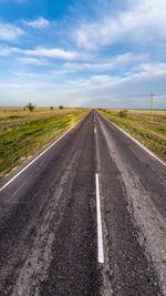 Empty road along landscape