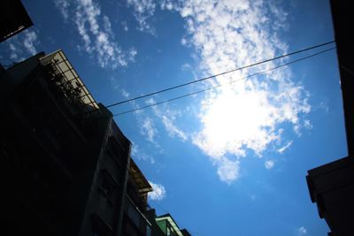 Low angle view of building against cloudy sky