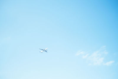 Low angle view of airplane flying in sky