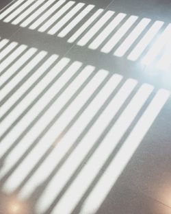 Close-up of shadow on tiled floor