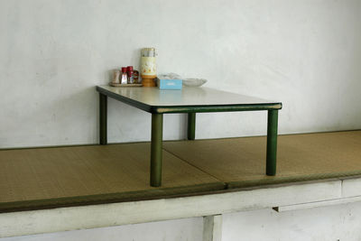 Table and chairs on wall at home