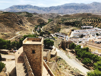 High angle view of townscape and mountains