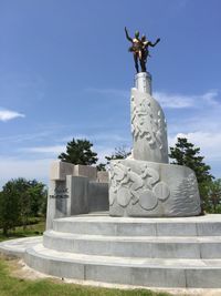 Low angle view of statue against sky