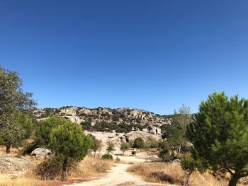 Scenic view of landscape against clear blue sky